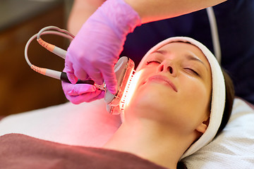 Image showing young woman having face microdermabrasion at spa