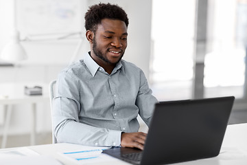 Image showing african american businessman with laptop at office