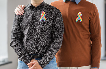 Image showing close up of couple with gay pride rainbow ribbons