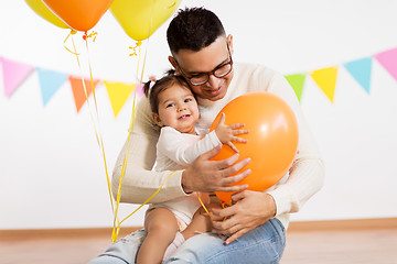 Image showing father and daughter with birthday party balloons