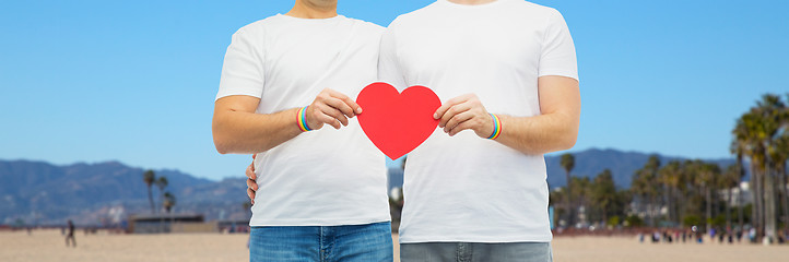 Image showing couple with gay pride rainbow wristbands and heart