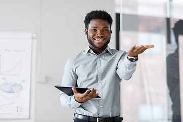 Image showing businessman with tablet pc at office presentation