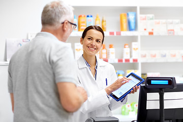 Image showing apothecary and customer with tablet pc at pharmacy