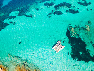 Image showing Drone aerial view of catamaran sailing boat in Maddalena Archipelago, Sardinia, Italy.