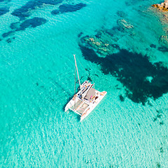 Image showing Drone aerial view of catamaran sailing boat in Maddalena Archipelago, Sardinia, Italy.