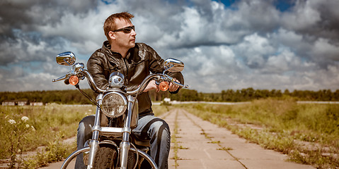 Image showing Biker on a motorcycle