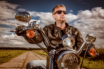 Image showing Biker on a motorcycle