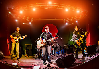 Image showing Band performs on stage in a nightclub