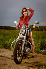 Image showing Biker girl and motorcycle