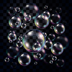 Image showing Transparent and multicolored soap bubbles over dark 