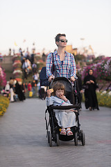 Image showing mother and daughter in flower garden