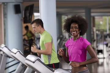 Image showing people exercisinng a cardio on treadmill