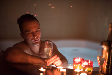 Image showing man relaxing in the jacuzzi