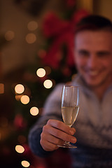 Image showing Happy young man with a glass of champagne