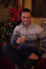 Image showing Happy young man with a glass of champagne