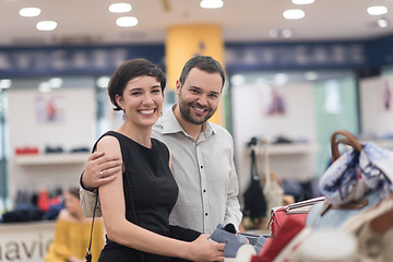 Image showing couple chooses shoes At Shoe Store