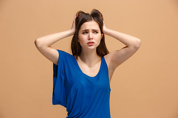 Image showing Beautiful woman in stress isolated on pastel