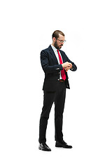 Image showing businessman looking at his watch on his hand, watching the time