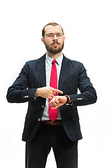 Image showing businessman looking at his watch on his hand, watching the time