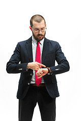 Image showing businessman looking at his watch on his hand, watching the time