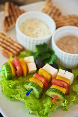 Image showing toast with cheese vegetables and olive on the stick