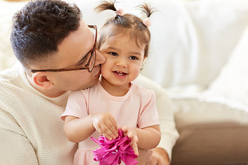 Image showing close up of father kissing little daughter