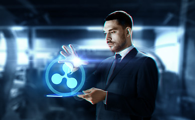 Image showing businessman with tablet pc and ripple hologram