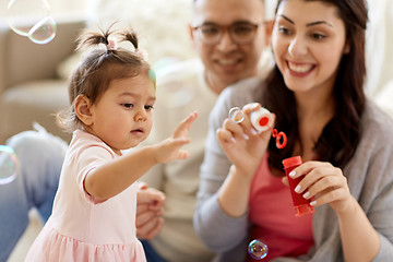 Image showing family with soap bubbles playing at home