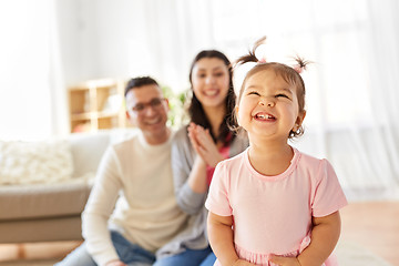 Image showing happy baby girl and parents at home