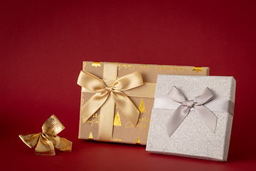 Image showing Christmas decoration with two gift boxes on red background