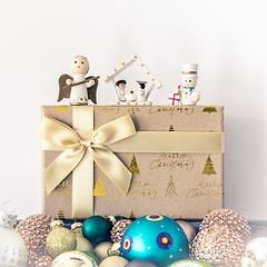 Image showing Christmas decoration with wooden figures glass balls and gift bo