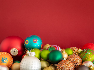 Image showing Christmas decoration glass balls on red background