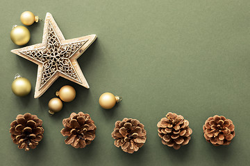 Image showing Christmas decoration background with pine cones and a star