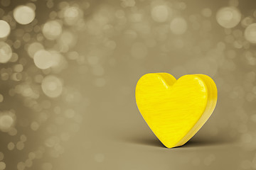 Image showing A yellow wooden heart in a bokeh lights background