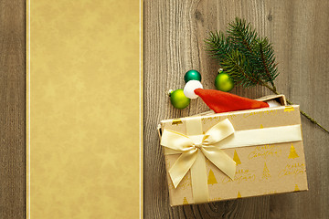 Image showing christmas decoration background with a gift on wooden background