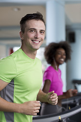 Image showing people exercisinng a cardio on treadmill