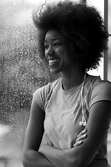 Image showing portrait of young afro american woman in gym while listening mus