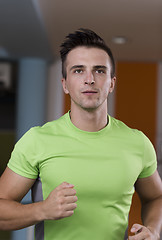 Image showing sportsman exercise jogging on treadmill