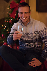Image showing Happy young man with a glass of champagne