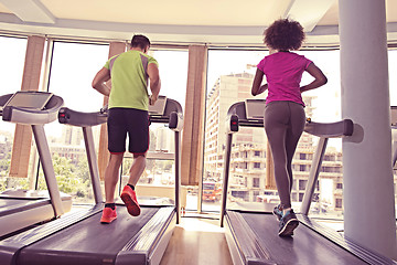 Image showing people exercisinng a cardio on treadmill