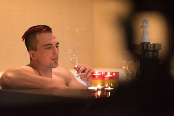 Image showing man relaxing in the jacuzzi