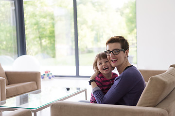 Image showing mother and cute little girl enjoying their free time