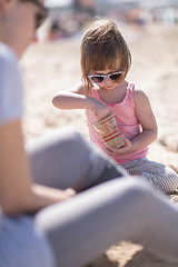 Image showing Mom and daughter on the beach