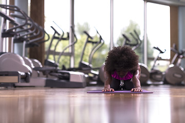 Image showing african american woman exercise yoga in gym