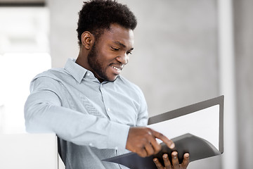 Image showing african american businessman with folder at office