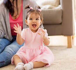 Image showing happy baby girl with mother at home