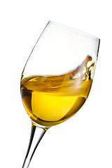 Image showing Moving glass of white wine