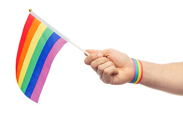 Image showing hand with gay pride rainbow flag and wristband