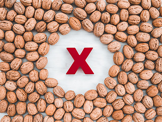 Image showing Walnuts on white background with red X in the middle