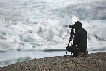 Image showing Photographer with tripod